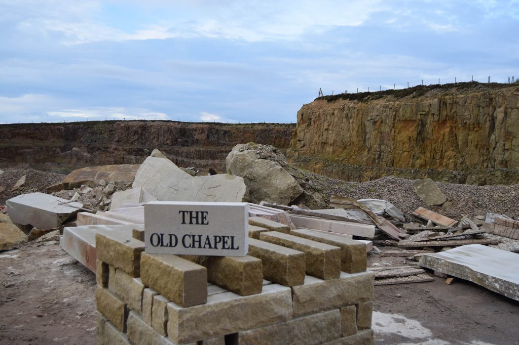 Old Chapel sign with quarry in background