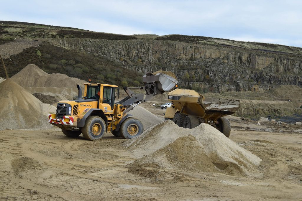 loading sand onto transport vehicle