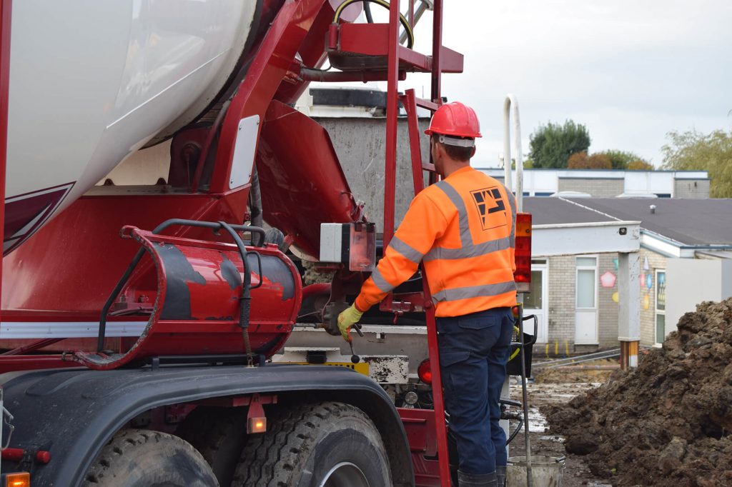 worker using vehicle controls