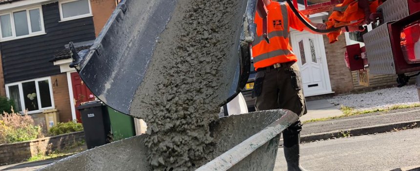 Pouring concrete in residential area