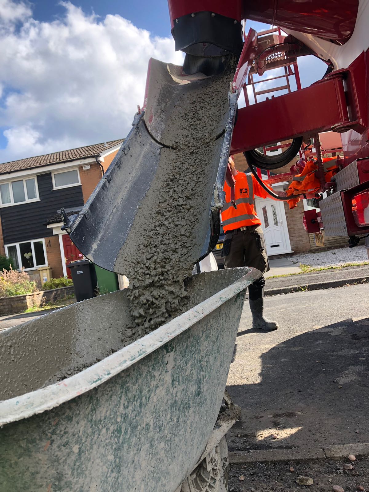 Pouring concrete in residential area